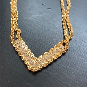 V accented gold and crystal necklace